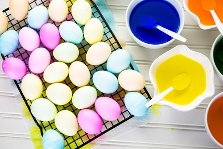 Painting eggs in pastel colors for Easter.