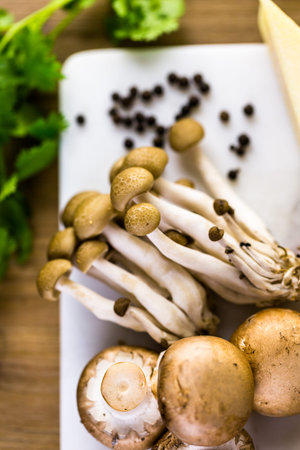 Ingredients for preparing fettuccine with creamy mushroom sauce.