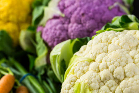 Fresh organic vegetable in season on old farm table.の写真素材
