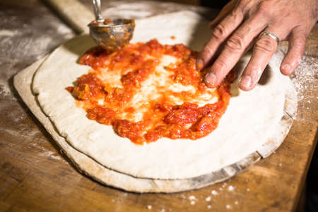 Making Napolitana Style Pizza in Italian restaurant.の写真素材