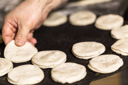 Baking bread for Italian meatball sliders in Italian restaurant.の写真素材