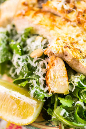 Arugula salad with grilled chicken in Italian restaurant.の写真素材
