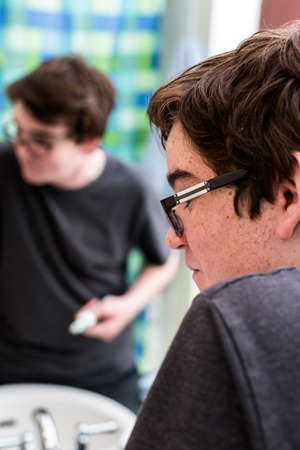 Teenage boy getting ready for school in the morning.の写真素材