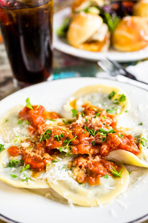 Fresh Italian gradmas raviolis on the table in Italian restaurant.の写真素材