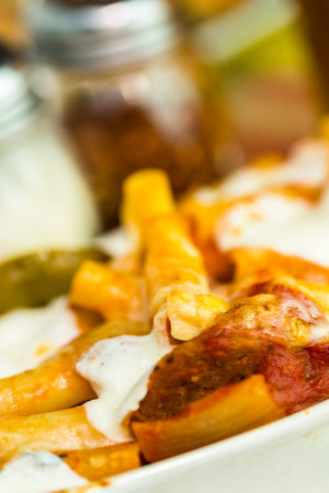 Fresh ziti pasta with sausage in Italian restaurant.