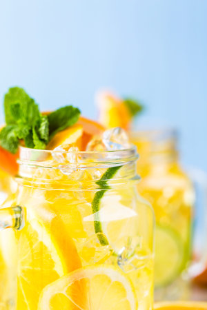 Infused water with fresh citrus fruits and ice.