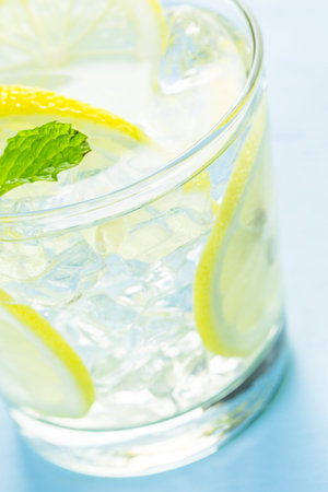 Infused water with fresh citrus fruits and ice.の写真素材