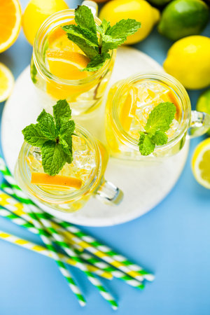 Infused water with fresh citrus fruits and ice.