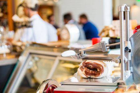 Vintage manual flywheel slicer at the restaurant.の写真素材