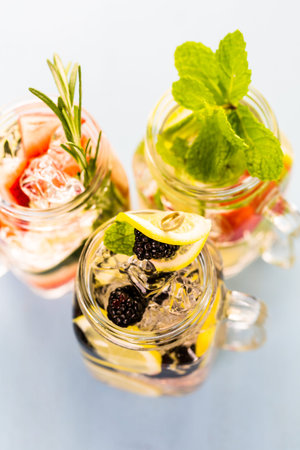 Fresh infused water made with organic ccitruses and berries.の写真素材