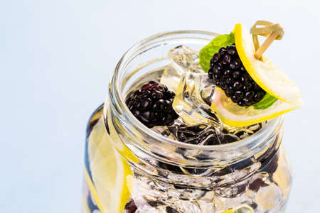 Fresh infused water made with organic ccitruses and berries.の写真素材