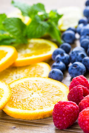 Sliced fresh organic fruits prepared to make infused water.の写真素材