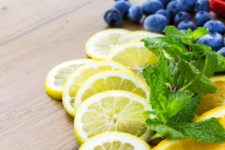 Sliced fresh organic fruits prepared to make infused water.の写真素材