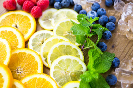Sliced fresh organic fruits prepared to make infused water.の写真素材