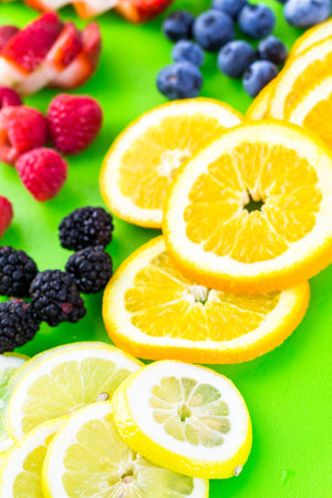 Sliced fresh organic fruits prepared to make infused water.の写真素材