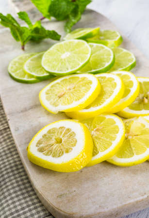 Sliced fresh organic fruits prepared to make infused water.の写真素材