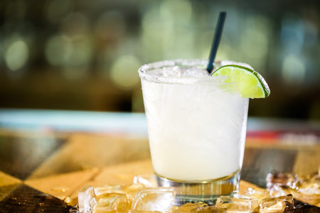 Mojito garnished with lime wedge at the bar.の写真素材