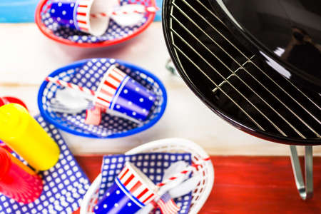 Table set with white, blue and red decorations for July 4th barbecue.の写真素材