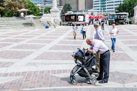 Denver, Colorado, USA-June 11, 2015. Young father spending his lunch time with his baby.のeditorial素材
