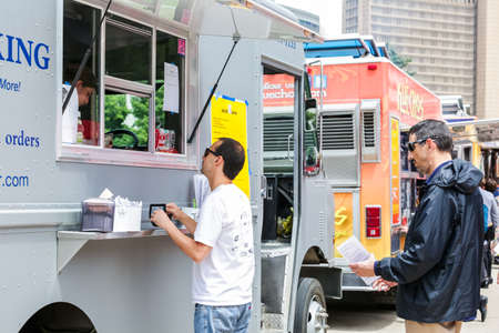 Denver, Colorado, USA-June 11, 2015.  Gathering of gourmet food trucks and carts in Downtown Denver Civic Center Park.のeditorial素材