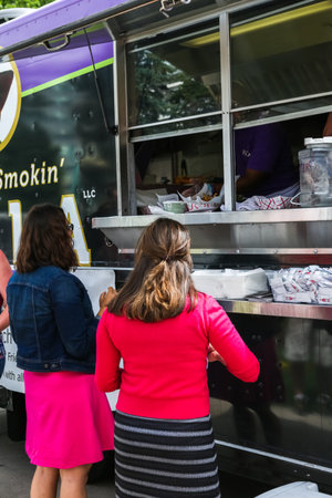 Denver, Colorado, USA-June 11, 2015.  Gathering of gourmet food trucks and carts in Downtown Denver Civic Center Park.のeditorial素材
