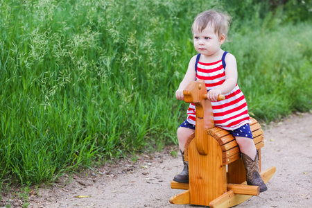 Toddlers having fun in the park for July Fourth.の写真素材