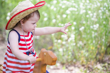 Toddlers having fun in the park for July Fourth.の写真素材