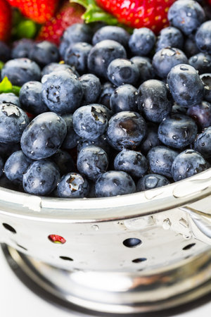Colander with washed organic berries.