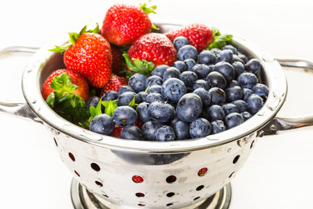 Colander with washed organic berries.の写真素材