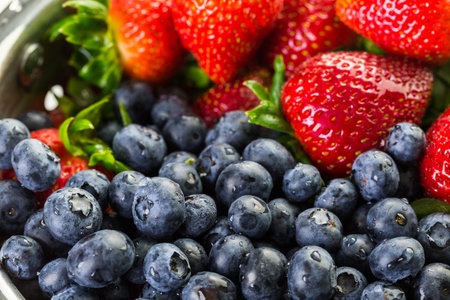 Colander with washed organic berries.の写真素材