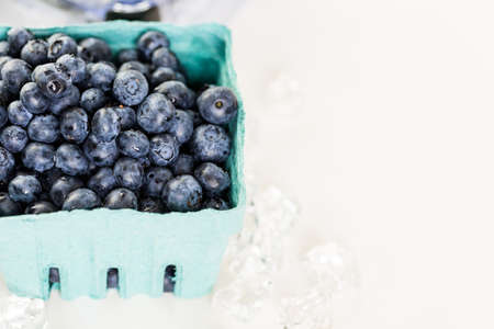 Ingredients to make smoothie with plain yogurt and fresh berries on the table.の写真素材