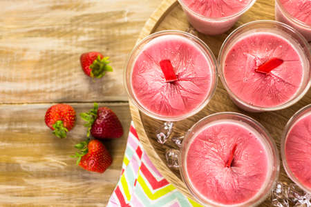 Homemade strawberry   ice cream made in plastic cups.の写真素材