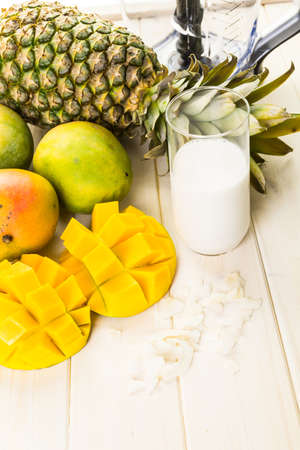 Fresh ingredients on the table to make smoothie with tropical fruits.の写真素材