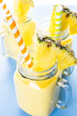 Homemade mango and pineapple smoothie made with coonut milk.