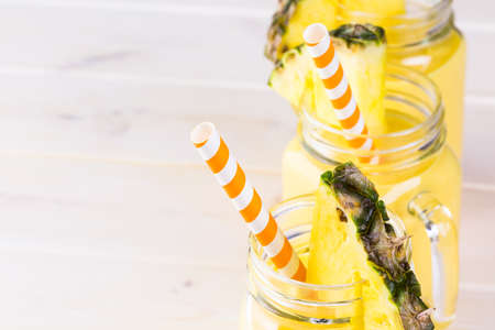 Homemade mango and pineapple smoothie made with coonut milk.の写真素材