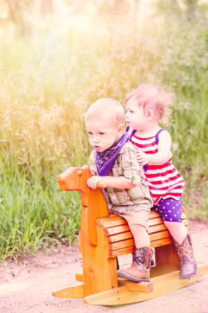 Toddlers having fun in the park for July Fourth.の写真素材