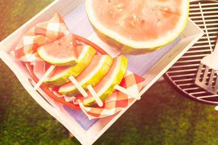 Yummy watermelon slice for refreshing treat at the summer picnic.の写真素材