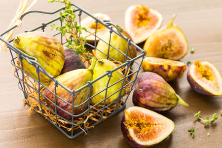 Organic California figs on wood table.の写真素材