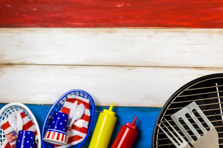 Small round charcoal grill ready for grilling at the summer picnic.の写真素材