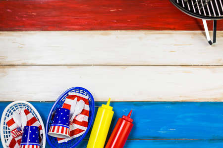 Small round charcoal grill ready for grilling at the summer picnic.の写真素材