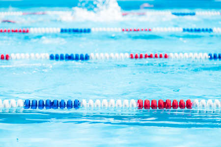 Kids swim meet in outdoor pool during the summer.の写真素材