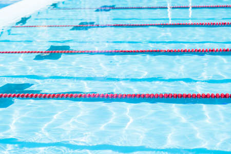 Kids swim meet in outdoor pool during the summer.の写真素材