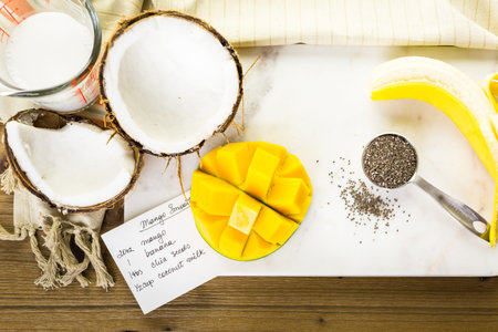 Freshly made mango banana smoothie with chia seeds.の写真素材