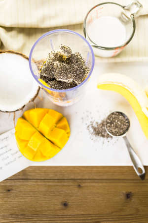 Freshly made mango banana smoothie with chia seeds.の写真素材