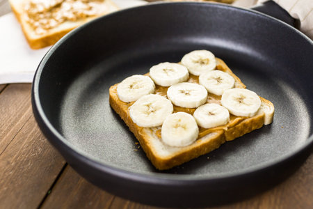Homemade peanut butter and banana  sandwich on white bread.