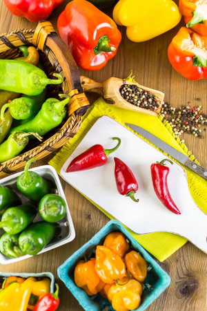 Variety of fresh organic peppers on the table.