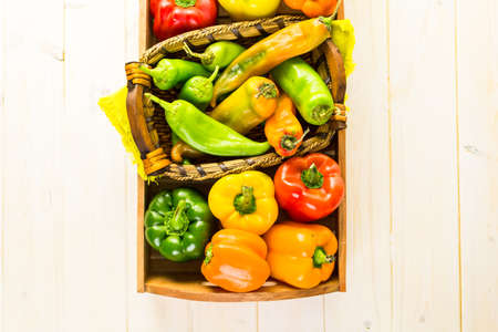Variety of fresh organic peppers on the table.の写真素材