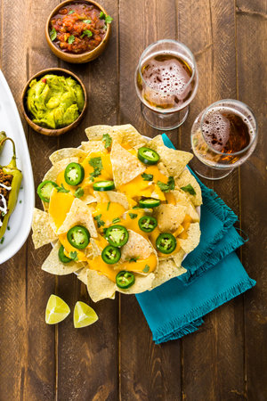 Vegetarian nachos with tortilla chips and fresh jalapeno peppers.の写真素材