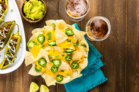 Vegetarian nachos with tortilla chips and fresh jalapeno peppers.の写真素材