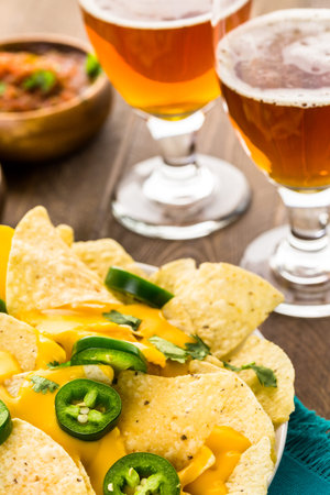 Vegetarian nachos with tortilla chips and fresh jalapeno peppers.の写真素材